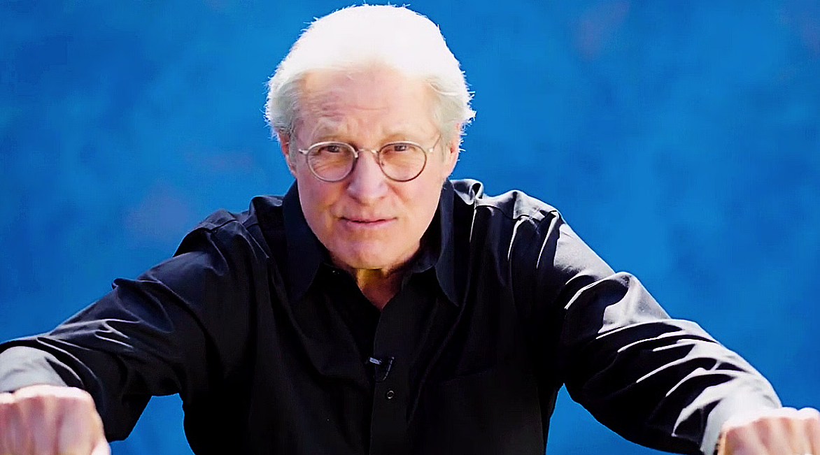 Bruce Boxleitner, mimicking the hand position for summoning a Light Cycle